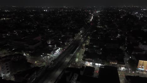 Aerial-Drone-Shot-of-Train-Passing-Through-Residence-Houses