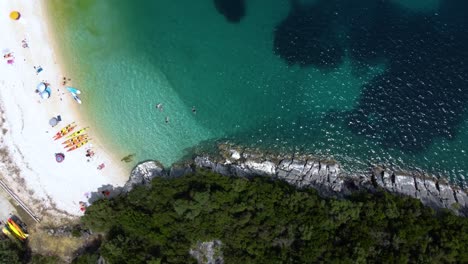 Top-View-over-Mikros-Poros-Gialos-Beach-WaterSports-Area,-Lefkada,-Greece