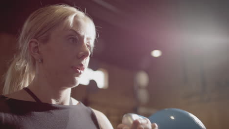 Female-Swedish-CrossFit-athlete-workout-with-kettlebell-in-gym,-slomo-closeup