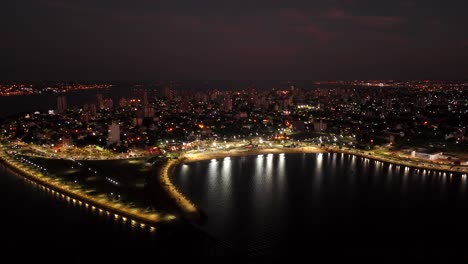 Aerial-shot-of-Posadas-city-at-night,-Argentina_pan-view