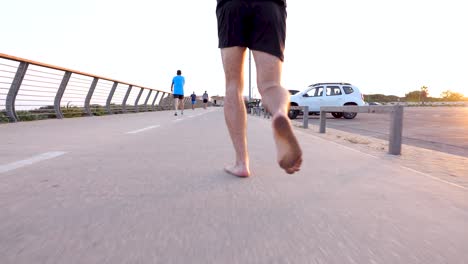 Running-barefoot-on-the-sidewalk