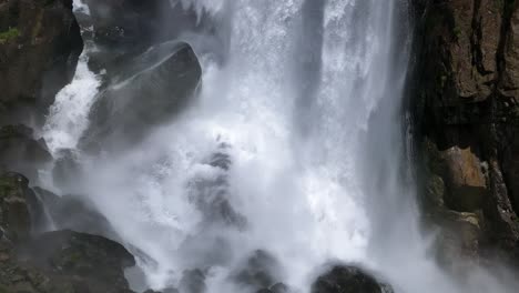 Close-up-of-Seerenbach-Falls'-powerful-cascade,-a-hidden-spectacle-of-nature-in-Walensee,-Switzerland