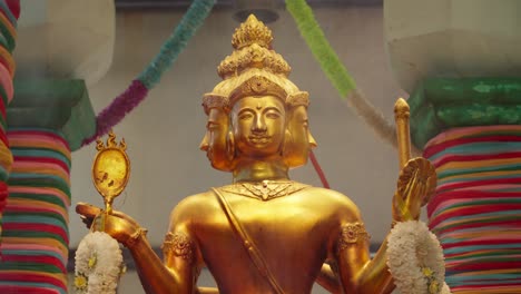 Smoke-From-Burning-Incense-In-Front-Of-Four-Faced-God-Statue,-Brahma-At-Temple