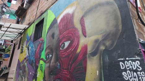 Vibrant-street-mural-in-Medellín's-Comuna-13-showcasing-colorful,-expressive-art-and-community-spirit