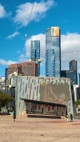 Vertical-4k-Time-Lapse,-Federation-Square-in-Melbourne-Australia,-Clouds,-People-and-Buildings