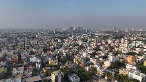 A-dynamic-drone-footage-capturing-the-essence-of-Chennai's-urban-landscape,-from-the-busy-city-under-a-cloudy-sky