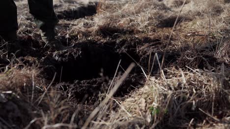 Digging-Soil-On-Farm-Field-With-Shovel