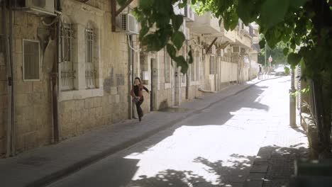 Jewish-kid-running-in-the-street-front-view