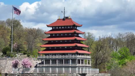 Reading-Pagoda-with-American-flag-and-cherry-blossom-tree-in-Pennsylvania