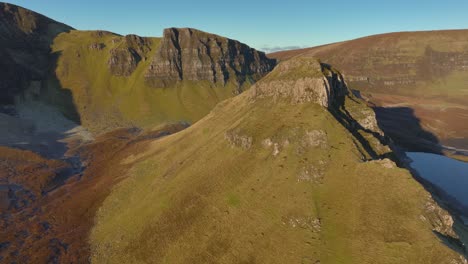 Cliffs-and-isolated-peak-of-landslip-in-early-morning-winter-sunshine