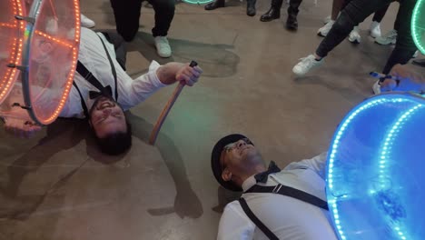 Slow-motion-shot-of-a-group-of-drummer-laying-on-the-floor-performing-at-a-wedding