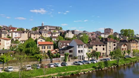 Drone-flying-over-Vienne-river-with-Maison-diocésaine-or-diocesan-house-in-background,-Limoges-in-France