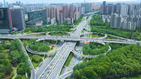 Massive-Highway-Road-Intersection-Interchange-Crossroad-With-Busy-Urban-Traffic-Speeding-In-City-Central