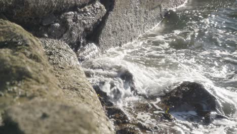 Outdoor-environment,-surface-water-motion,-incoming-tide-movement,-slow-mo