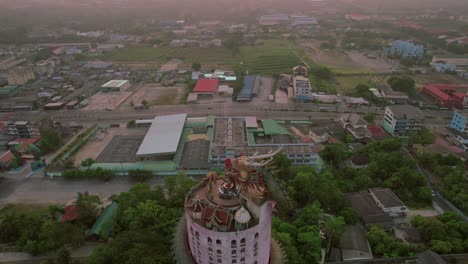 Drone-circling-around-of-the-Wat-Sam-Phran,-The-Dragon-Temple-in-Bangkok,-Thailand