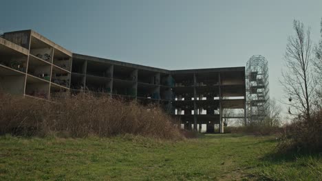 Abandoned-university-hospital-in-Zagreb,-overtaken-by-nature-and-urban-art