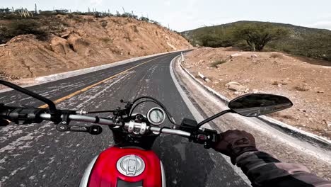 Motorcyclist-driving-on-highway-route