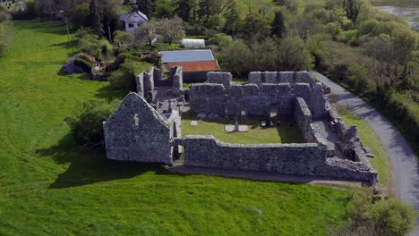 Dynamic-aerial-captures-a-wide-shot-of-Annaghdown-Abbey