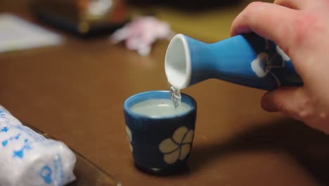 Bottle-of-Hot-Sake-Pouring-in-Slow-Motion