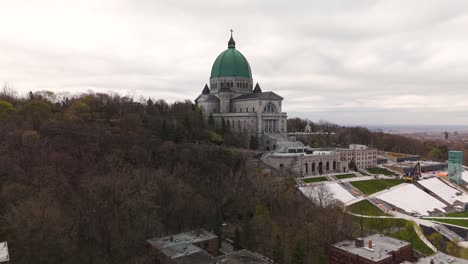 aerial-footage-of-Saint-Joseph's-Oratory-of-Mount-Royal,-Montreal-famous-landmark-roman-Catholic-Basilica-cathedral