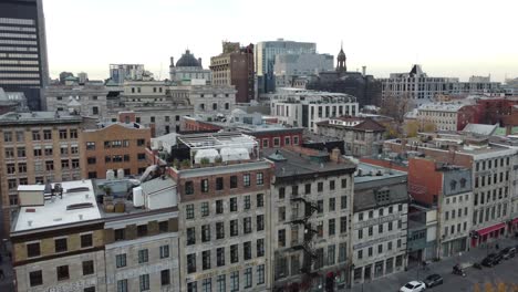 Colonial-old-building-urban-cityscape-in-Old-Port-district-of-Montreal-Quebec-Canada-,-aerial-footage