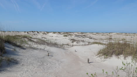 Sand-dunes-with-the-ocean-in-the-distance