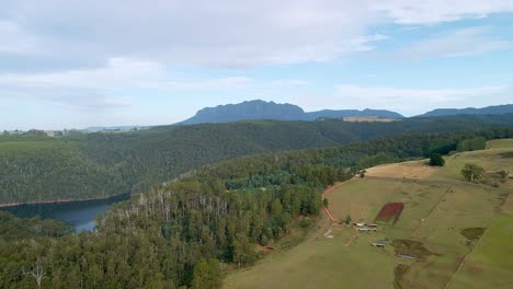 Aerial-view-of-Mount-Roland,-Lake-Barrington-and-rural-farm-land-near-Sheffield-in-Tasmania,-Australia