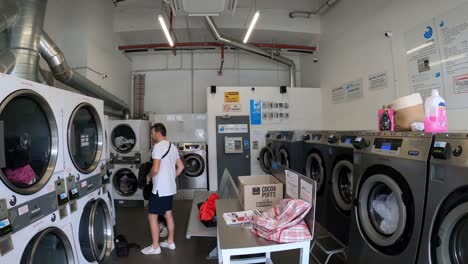Couple-standing-in-a-liquid-laundromat-during-there-holiday-in-Queenstown