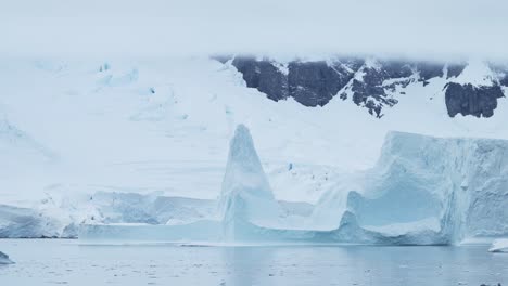 Large-Antarctica-Icebergs-Winter-Scenery,-Amazing-Shapes-Ice-Formations-of-Massive-Big-Enormous-Blue-Iceberg-in-Beautiful-Antarctic-Peninsula-Landscape-Seascape-with-Ocean-Sea-Water