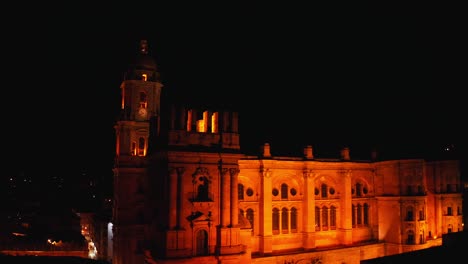 Aerial-drone-View-of-Malaga-Cathedral-at-Night-in-Malaga-City,-Andalusia,-Spain