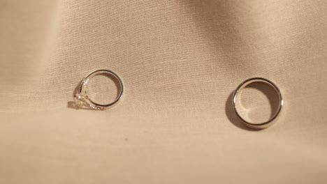 Two-Gold-Rings-on-velvet-fabric-background