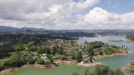 Aerial-view-of-El-Peñón-de-Guatapé-Lake-in-Colombia,-showcasing-the-unique,-lush-green-islands-and-clear-blue-waters