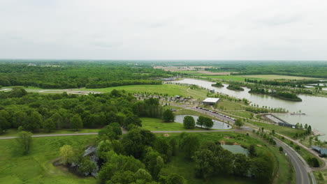 Shelby-farms-park-in-memphis,-showing-lush-greenery-and-water-bodies,-on-a-cloudy-day,-wide-shot,-aerial-view