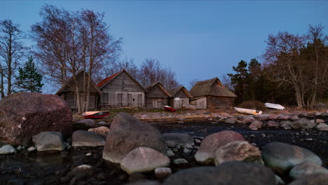 Timelapse-of-fishing-village-at-dusk,-Altja-rebuilt-hut,-Estonia-seaside-historical-museum