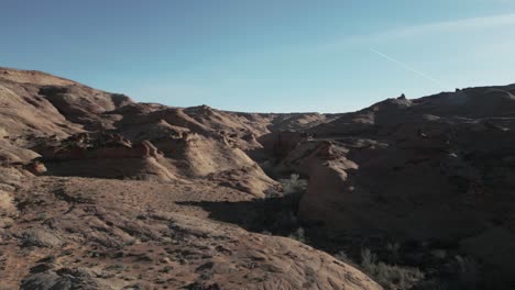From-an-aerial-perspective,-the-rough,-arid-stretch-of-Utah's-terrain-is-revealed,-emphasizing-the-unspoiled-magnificence-of-nature-in-its-primal-state