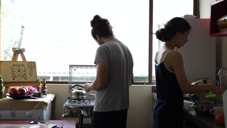 Young-couple-prepare-breakfast-together-in-the-morning-and-in-pajamas