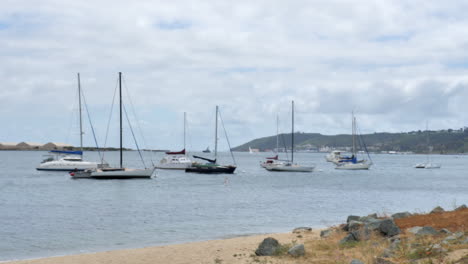 Sailboats-anchored-by-a-beach