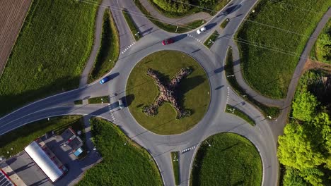 Several-cars-travel-through-5-pointed-round-about