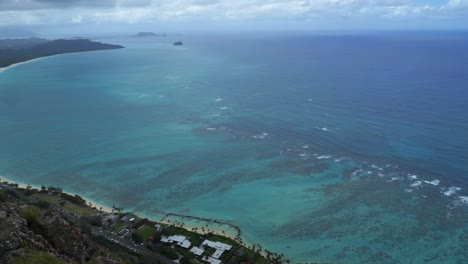 aerial-shot-of-waves-crashing-into-the-hawaiian-shore