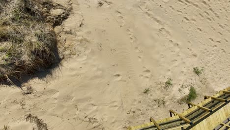 Direct-aerial-showing-the-sand,-dunes,-and-stair-access-point