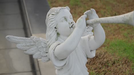 Statue-Of-Angel-Blowing-Trumpet.-closeup-shot