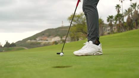 sinking-a-putt-on-the-golf-course