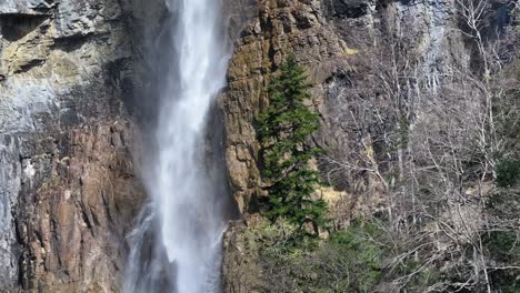 Majestic-Seerenbach-Falls-cascading-against-rocky-cliffs-in-Amden,-Betlis-near-Walensee,-Switzerland
