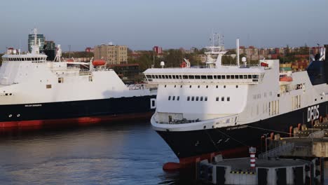 Two-large-ferries-of-the-DFDS-company-are-standing-at-the-berth-in-the-port,-waiting-to-be-loaded-and-ready-to-move,-from-Klaipeda-port