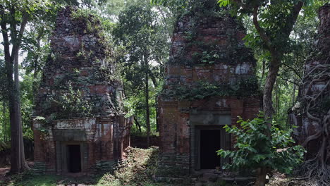 Cambodian-jungle-has-reclaimed-ancient-stone,-brick-temple-at-Koh-Ker