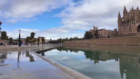 Plama-de-Mallorca-cathedral-with-Gauid-architecture-reflecting-in-water-after-a-shower