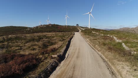 Mountain-Road-With-Wind-Turbine-Aerial-View