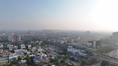 A-captivating-drone-shot-of-Chennai,-highlighting-the-city's-bustling-streets-and-towering-skyscrapers