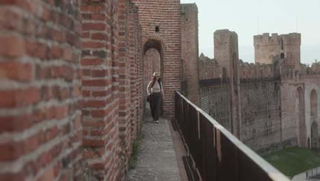 Portrait-Of-A-Woman-On-The-Walkway-At-Defense-Wall-In-Cittadella,-Italy