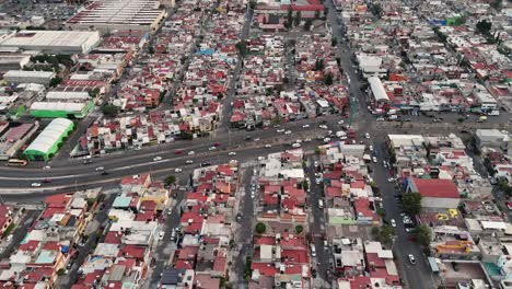 Aerial-footage-captured-by-a-drone-showcases-houses-and-avenue-of-Ecatepec,-located-north-of-CDMX